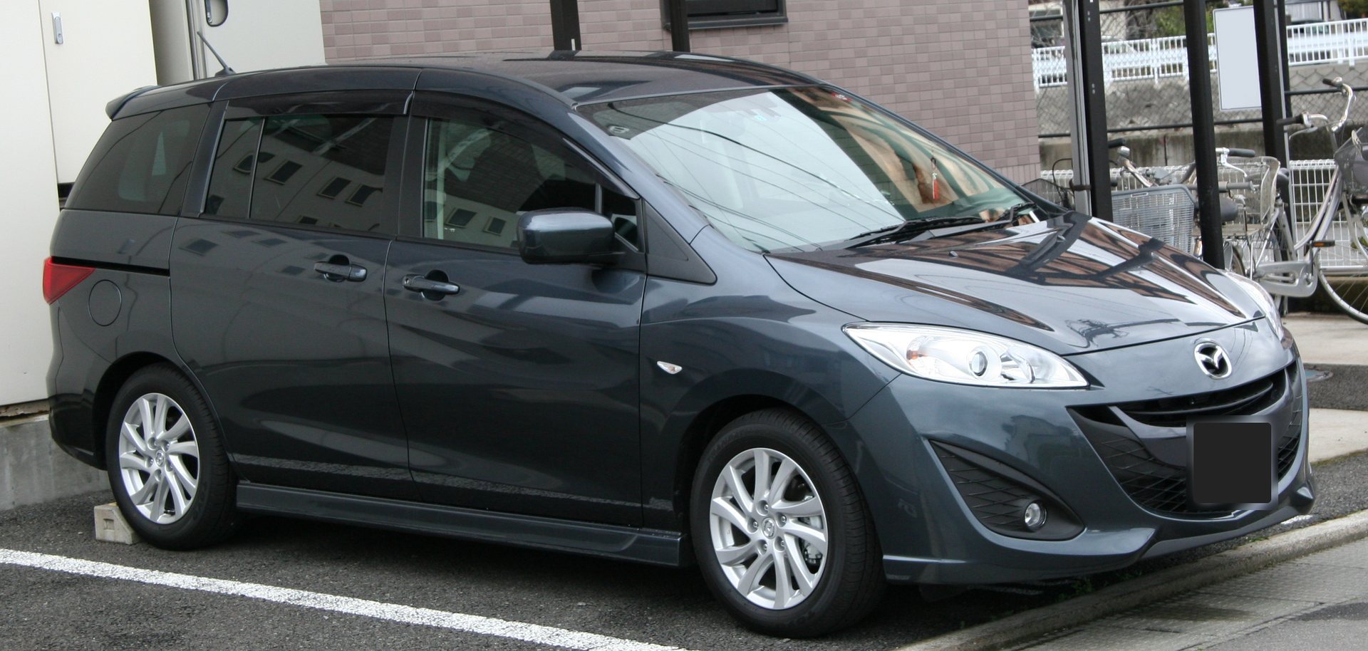 Example photo: grey Mazda Premacy, front three-quarter view. Not the actual car.